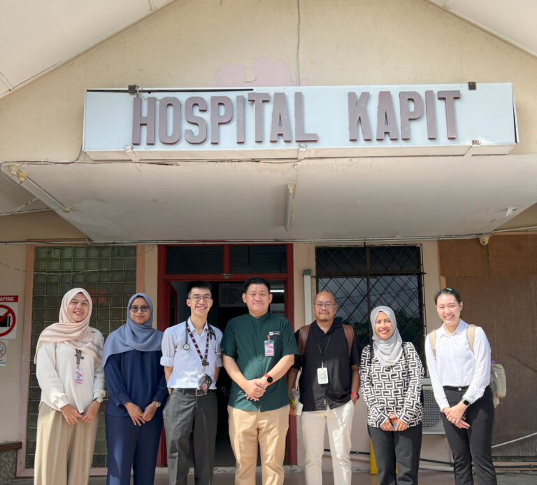 Dr Khairunnisa (second from right) with the Hospital Kapit team. Dr Francis Lee, director of the hospital, is third from left