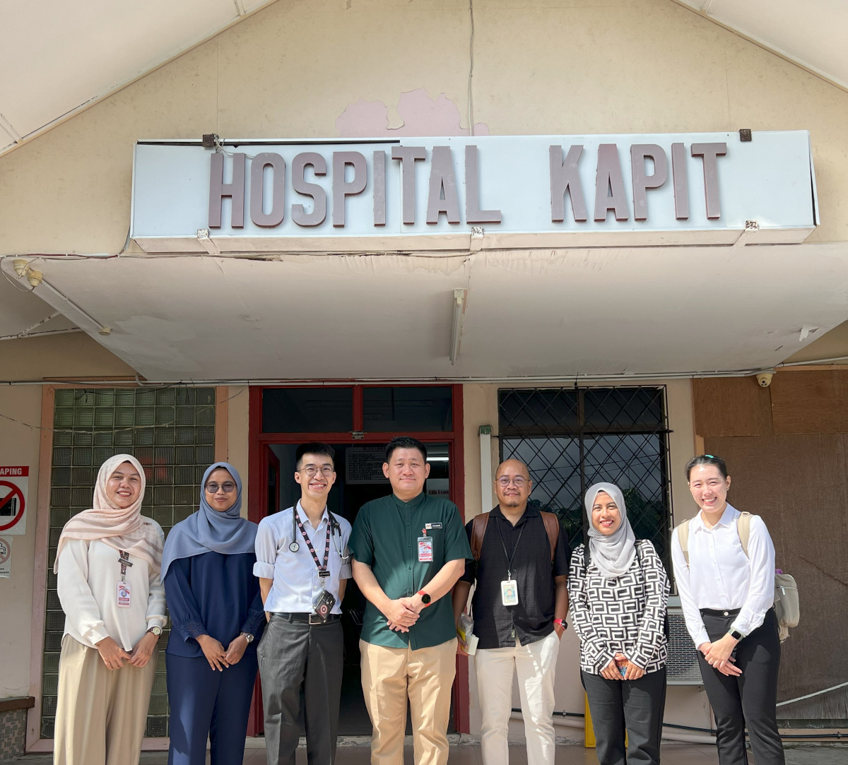 Dr Khairunnisa (second from right) with the Hospital Kapit team. Dr Francis Lee, director of the hospital, is third from left