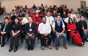 Professor Vimal Karani (second from right) attends