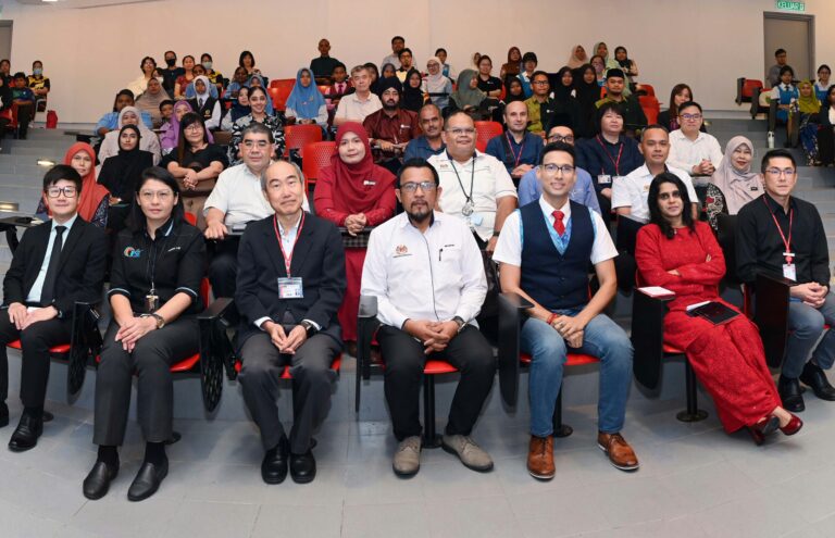 Professor Vimal Karani (second from right) attends