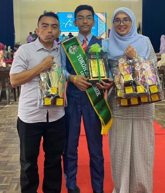 The author (left) with his youngest son, Yusuff at this years prize-giving ceremony. Photo by the author
