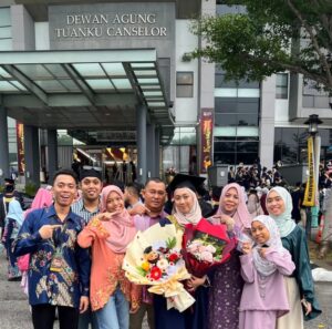 The author (three from right) celebrating her graduating daughter at UiTM
