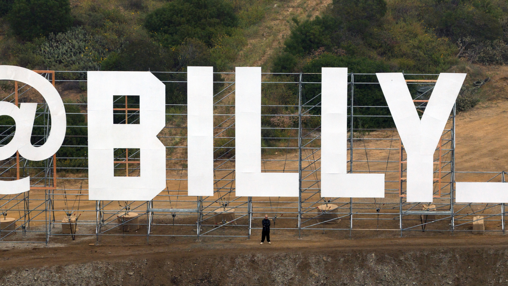 AI video director Billy Boman in Fiverr's new installation overlooking LA's 101 freeway