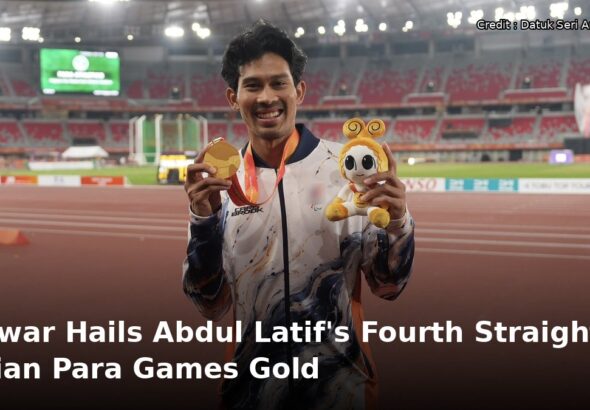 Abdul Latif Romly holding his gold medal at the Aichi-Nagoya 2026 Asian Para Games