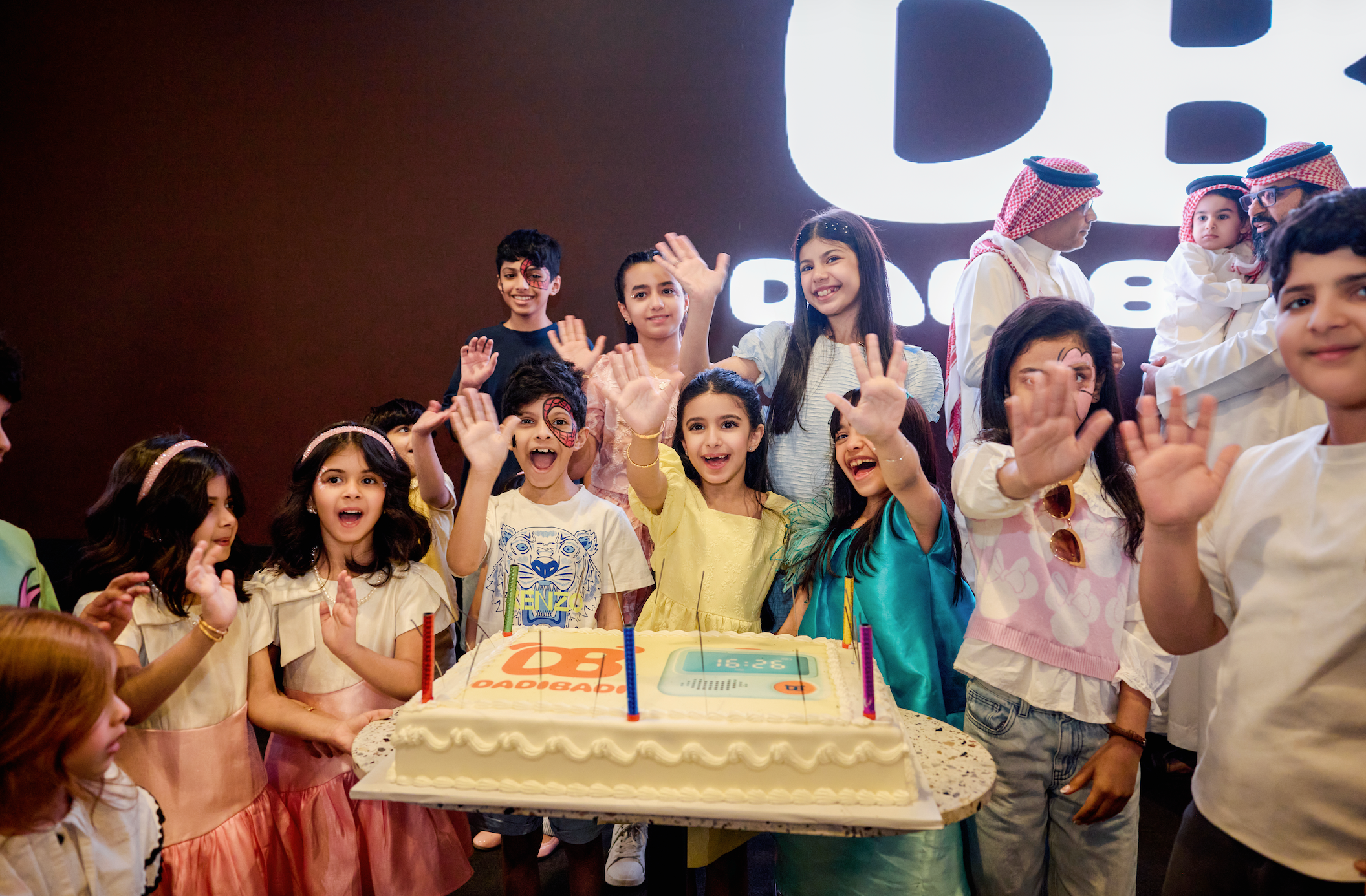 Children celebrating with Dadibadi cake at the launch party