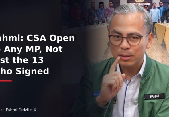 Communications Minister Fahmi Fadzil explaining the confidence and supply agreement