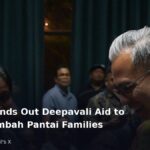 Fahmi Fadzil greeting residents at a Deepavali aid event in Lembah Pantai