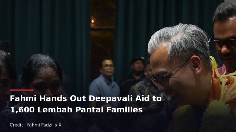 Fahmi Fadzil greeting residents at a Deepavali aid event in Lembah Pantai
