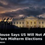 The White House at dusk with the headline: White House Says US Will Not Attack Iran Before Midterm Elections